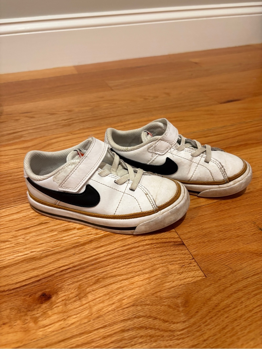 Nike Kids White Sneakers with Black Swoosh and Tan Trim
